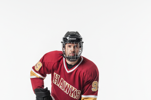 Hockey Player wearing helmet with cage on white background